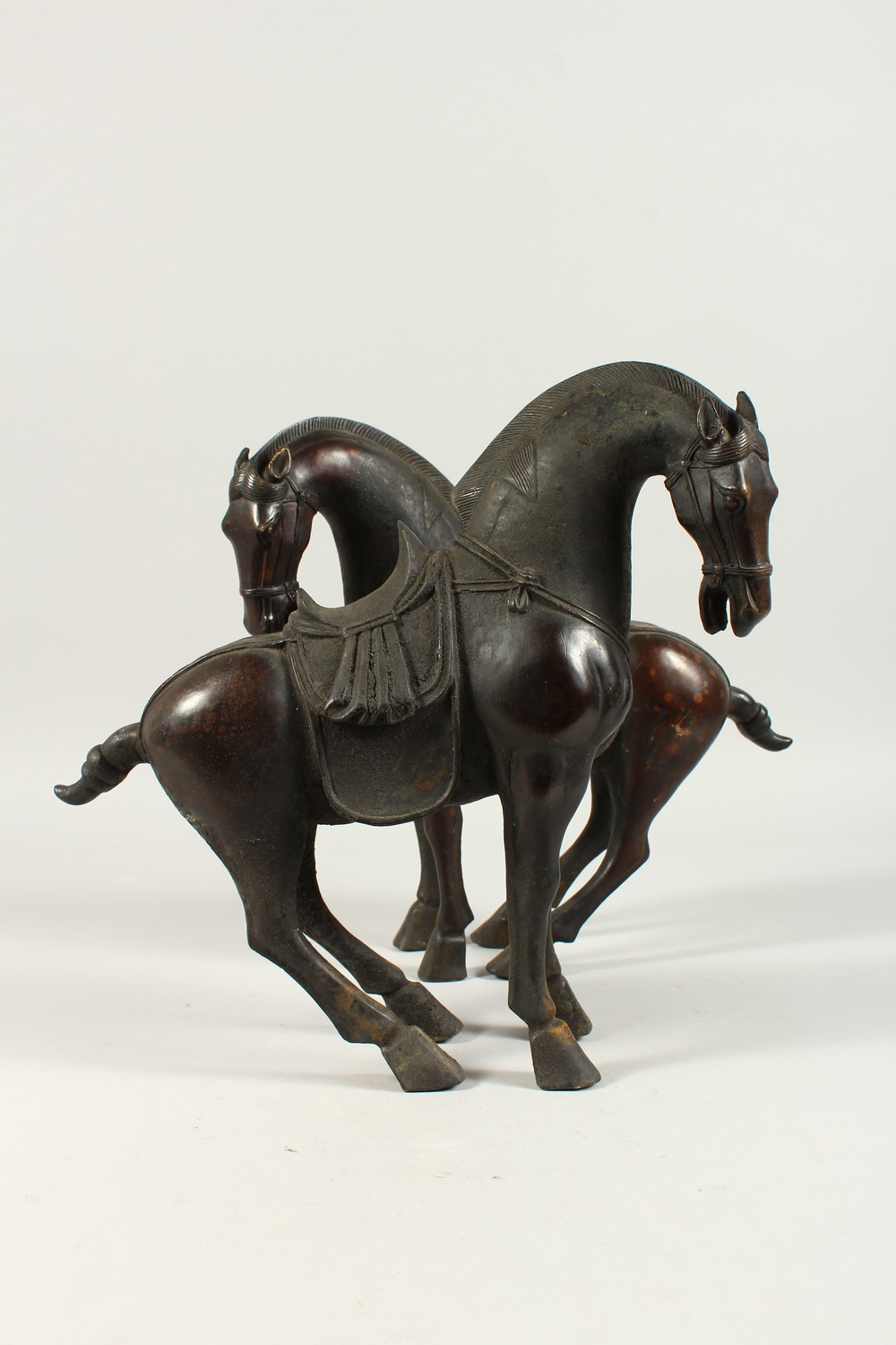 A PAIR OF BRONZE TANG STYE STANDING HORSES. 29cms high. - Image 2 of 6