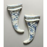 A SUPERB PAIR OF 18TH CENTURY WORCESTER BLUE AND WHITE CORNUCOPIA WALL VASES, the rim with flowers
