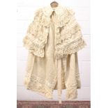 VICTORIAN CREAM CAPE COAT, with lace ruffed collar and trim, lined with silk to the front.
