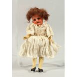 ARMAND MARSEILLE, A30M A bisque headed baby doll with articulated body. 7ins long.