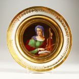A 19TH CENTURY CONTINENTAL CABINET PLATE, painted with a female figure playing a violin. 24cms