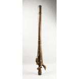 A LARGE EARLY BRASS FIREMAN'S WATER NOZZLE. 4ft 8ins long.