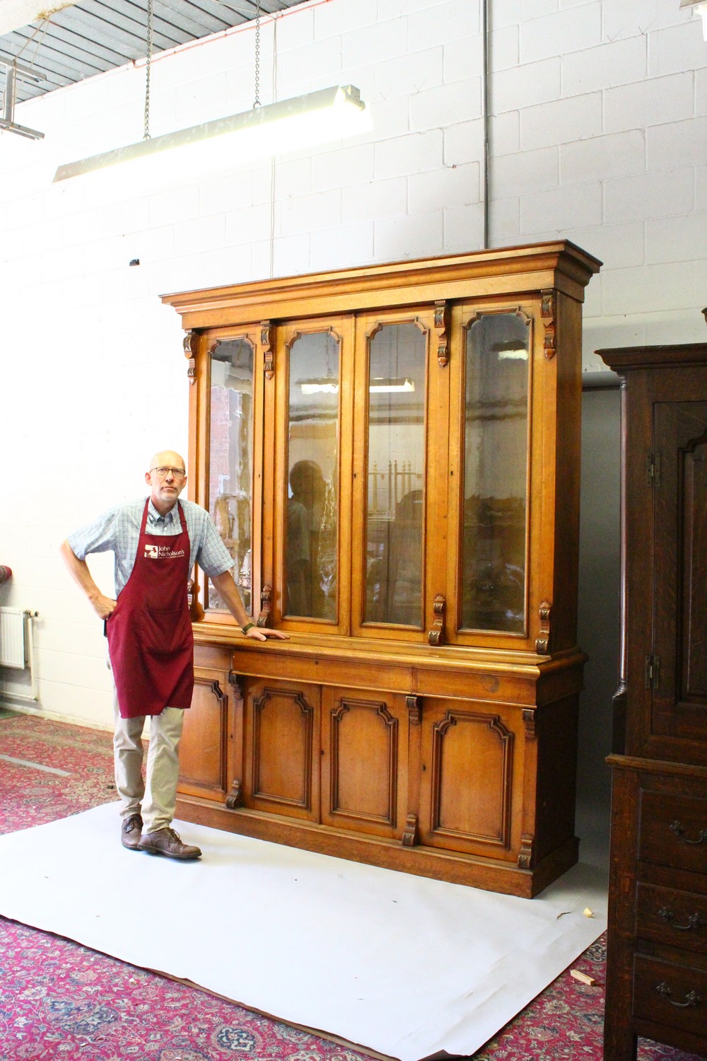 A VICTORIAN OAK LIBRARY BOOKCASE, with a moulded cornice above four glazed doors enclosing - Image 16 of 17
