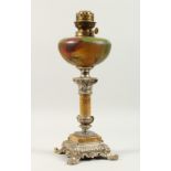 A DECORATIVE TABLE LAMP, modelled as an oil lamp, with painted glass reservoir, marble column with