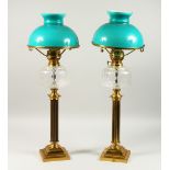 A PAIR OF VICTORIAN STYLE BRASS AND GLASS CORINTHIAN COLUMN ELECTRIC TABLE LAMPS, modelled as oil