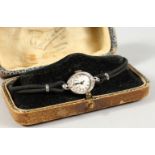 A LADIES 14CT WHITE GOLD AND DIAMOND COCKTAIL WRISTWATCH, in an old leather case.