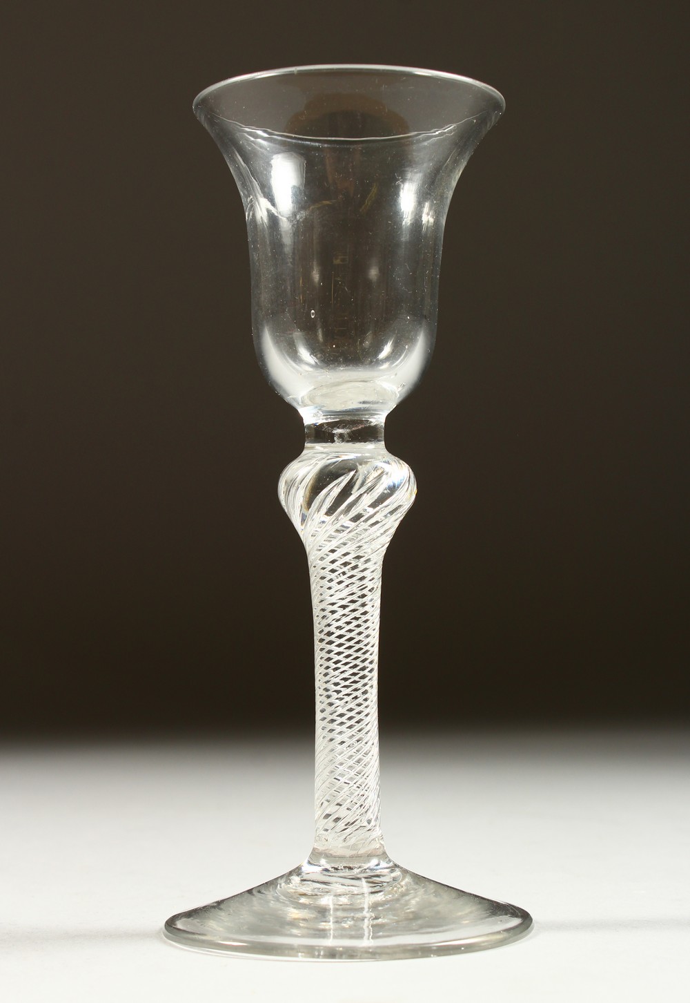 A GEORGE III AIR TWIST CORDIAL GLASS. 15cms high.