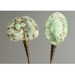 TWO HAIR PINS WITH CARVED JADE ENDS. 18cms long.