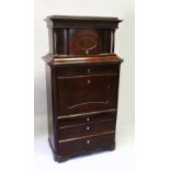 A 19TH CENTURY BEIDERMEIER MAHOGANY SECRETAIRE, the upper section with a moulded cornice over a