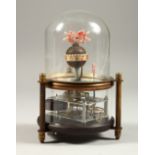 AN UNUSUAL AUTOMATON FISH CLOCK, under a glass dome, modern. 14cms high.