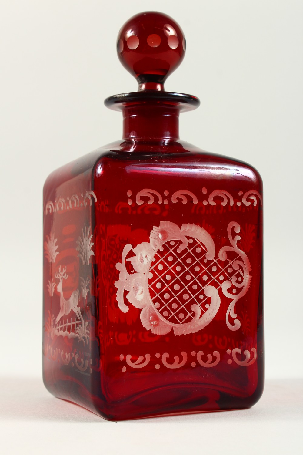 A BOHEMIAN SQUARE SHAPE RUBY GLASS DECANTER, engraved with a castle and a deer. 19cms high. - Image 3 of 9