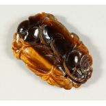 A TIGER'S-EYE CARVING.
