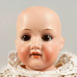 ARMAND MARSEILLE, No. 370 A4/0M A bisque headed baby doll with articulated body. 1ft 4ins long.