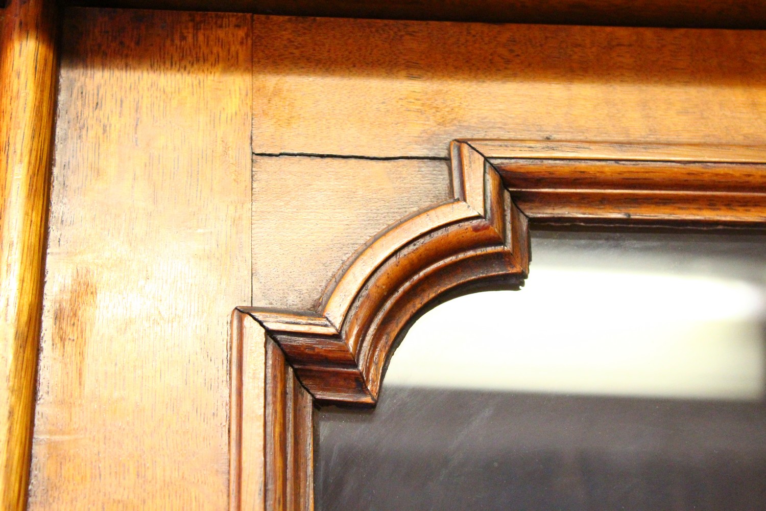 A VICTORIAN OAK LIBRARY BOOKCASE, with a moulded cornice above four glazed doors enclosing - Image 13 of 17