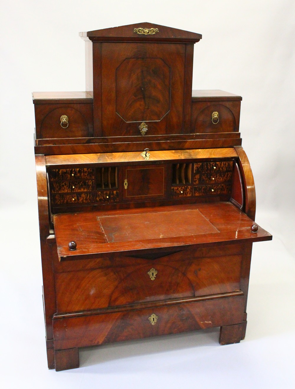 A 19TH CENTURY CONTINENTAL MAHOGANY CYLINDER BUREAU CABINET, the upper section with a central