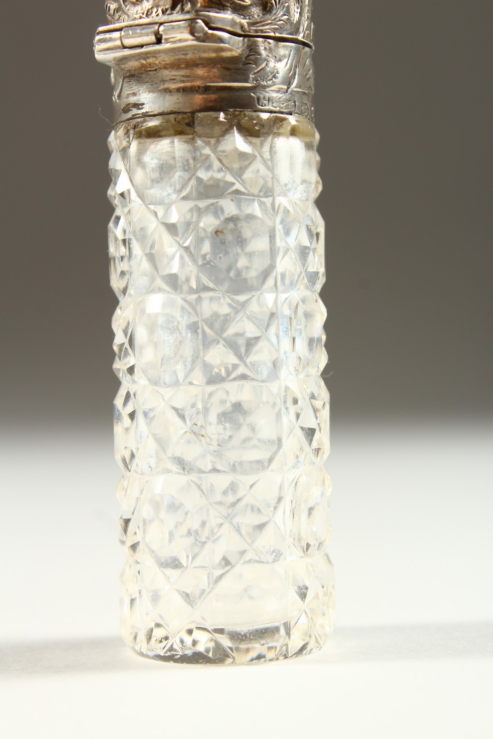 A VICTORIAN PLAIN CUT GLASS SCENT BOTTLE with repousse silver top and plain glass stopper. - Image 3 of 10