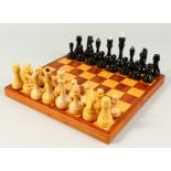 A RUSSIAN TURNED WOOD CHESS SET in a box.