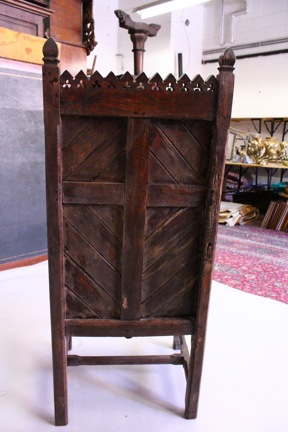 AN 18TH CENTURY AND LATER OAK GOTHIC ARMCHAIR, with pierced and carved cresting, tongue and groove - Image 8 of 9