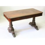 A REGENCY ROSEWOOD LIBRARY TABLE, with rounded rectangular top, the frieze drawers on turned