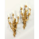 A PAIR OF ROCOCO STYLE ORMOLU FIVE BRANCH WALL APPLIQUES. 62cms high.