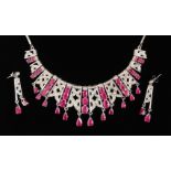 A SILVER .925 DIAMOND AND RUBY PASTE NECKLACE AND EARRINGS.