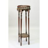 A TWO-TIER MAHOGANY JARDINIERE STAND. 33cms diameter x 98cms high.