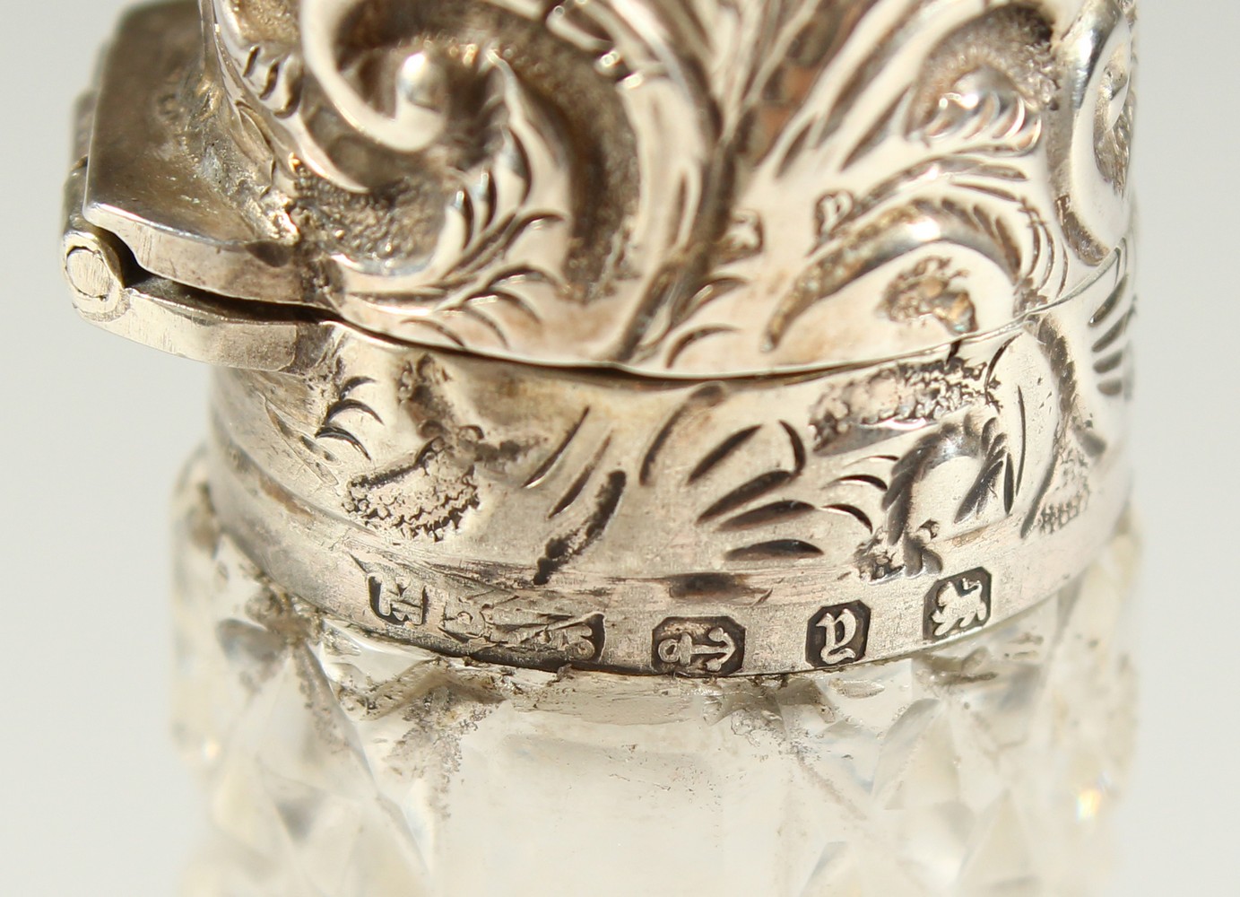 A VICTORIAN PLAIN CUT GLASS SCENT BOTTLE with repousse silver top and plain glass stopper. - Image 7 of 10
