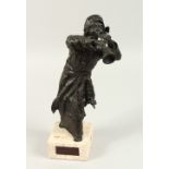 ANNE ROONEY (AMERICAN) "AL-MIZMAAR", standing male figure playing a horn. 37cms high.