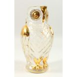 A MOULDED GLASS OWL SHAPE JUG, with gilded decoration. 26cms high.