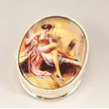 A SILVER AND ENAMEL OVAL PILL BOX, with a classic nude.