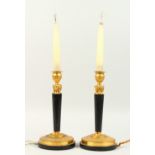 A PAIR OF THOMAS HOPE DESIGN BRONZE AND ORMOLU CIRCULAR STICKS, converted to electricity. 11ins