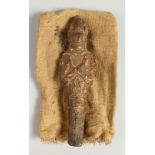 AN EGYPTIAN TERRACOTTA USHABTI. 21cms high.