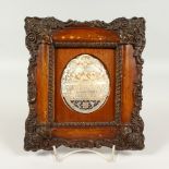 A CARVED MOTHER-OF-PEARL SHELL, depicting The Last Supper, in a decorative frame. 20.5cms high x