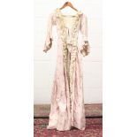 VICTORIAN BUSTLE DRESS, dating from about 1860, pink cotton with cream frill and lace trim,