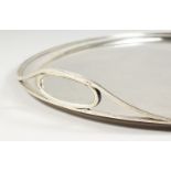 A RUSSIAN SAINT PETERSBURG SILVER PLAIN OVAL TWO-HANDLED TEA TRAY. Mark BC over 1873. 20ins long.