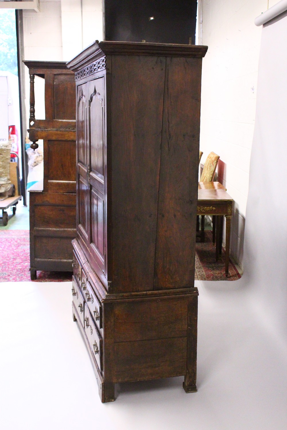 AN 18TH CENTURY OAK BACON CUPBOARD, with a moulded cornice, blind fret decorated frieze above a pair - Image 2 of 13