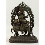 A BRONZE GROUP OF A CHINESE GOD ON A HORSE. 30cms high.