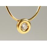 AN 18CT GOLD AND DIAMOND PENDANT AND CHAIN.