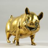 A HEAVY BRASS PIG. 9ins long.