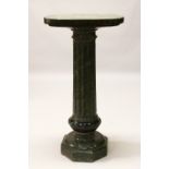 A LATE 19TH/EARLY 20TH CENTURY GREEN MARBLE PEDESTAL COLUMN, with an oval shaped top, fluted column,