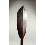 A GOOD PACIFIC ISLAND CARVED WOOD PADDLE CLUB, with shaped hand grip and broad blade. 111cms long.