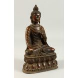 A CAST BRONZE SEATED THAI BUDDHA, on a lotus base. 28cms high.