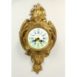 A FRENCH BRONZE CARTEL CLOCK, with white enamel dial, signed Charvet, Lyon. 52cms high.