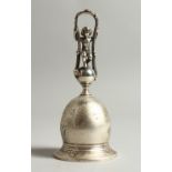 A SMALL CONTINENTAL SILVER TABLE BELL, with figural handle. 13cms high.