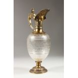 A SUPERB VICTORIAN CRYSTAL AND SILVER GILT CLARET JUG by CHARLES FOX, the glass engraved with