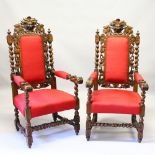 A GOOD LARGE PAIR OF OAK ARMCHAIRS, 20TH CENTURY, profusely carved with masks, grape and vine,