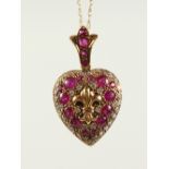 A GOOD 9CT GOLD, RUBY AND DIAMOND HEART SHAPED LOCKET on chain.