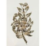 A SILVER MARCASITE BROOCH.