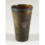 A VICTORIAN HORN BEAKER, with silver rim. London 1882.