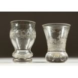A PLAIN GLASS BOHEMIAN BEAKER, etched with deer in a landscape setting, 4.75ins high, and another